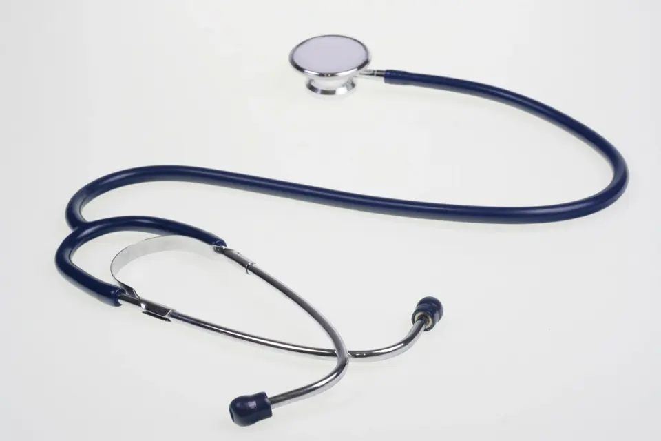 A stethoscope lying on a plain white surface